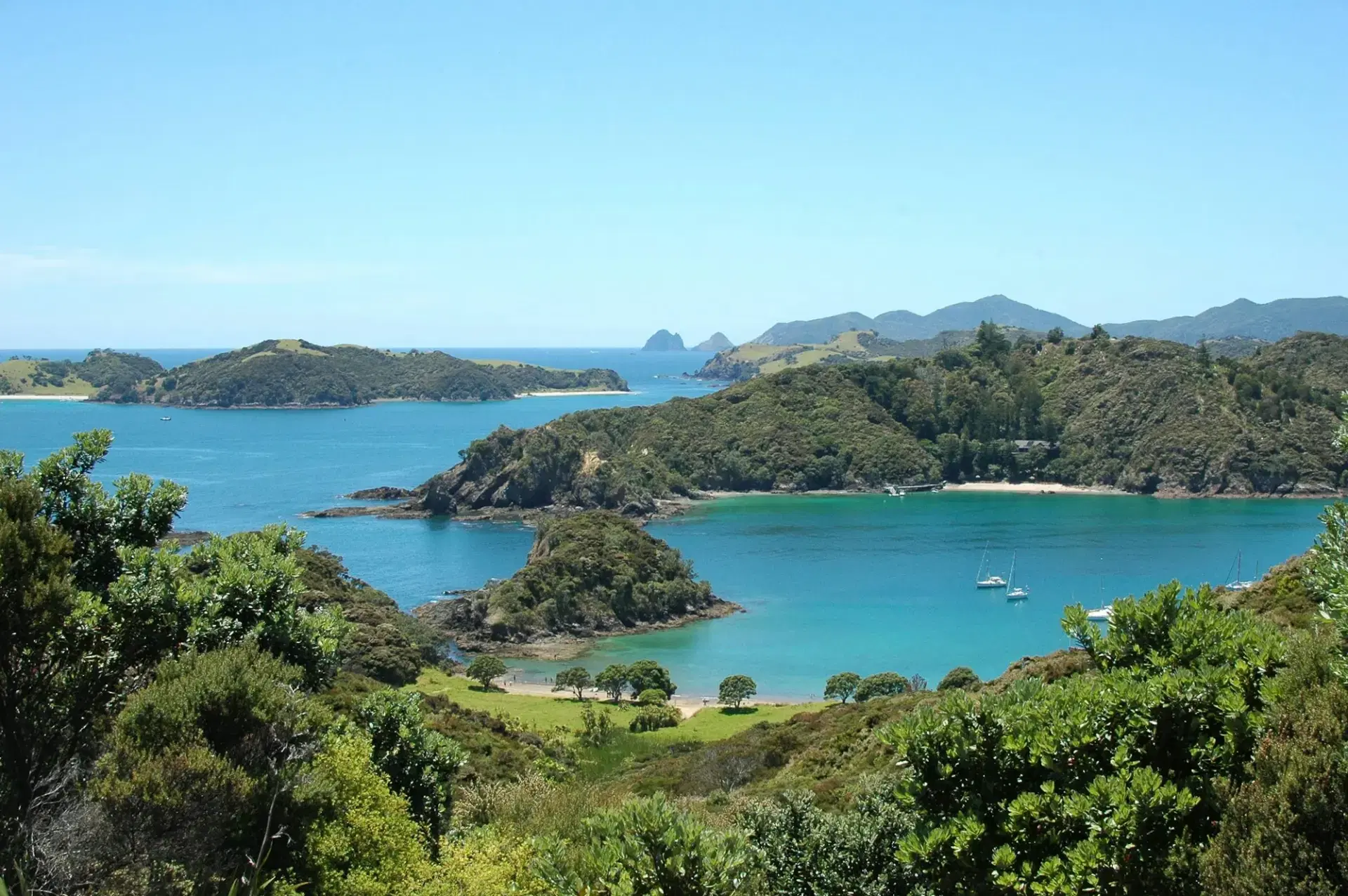 Bush-covered islands in the turquoise Bay of Islands