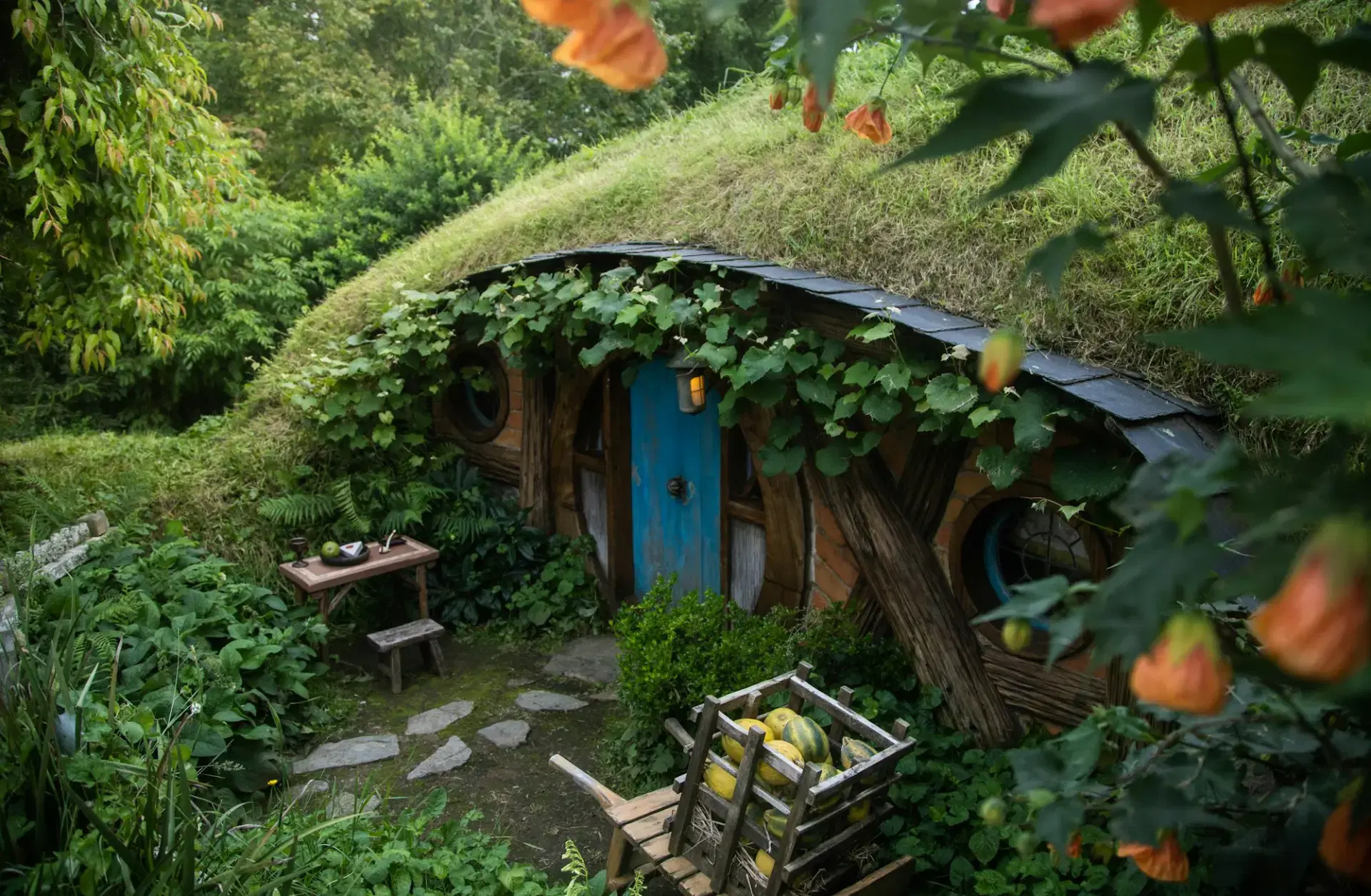 Hobbit house surrounded by lush gardens